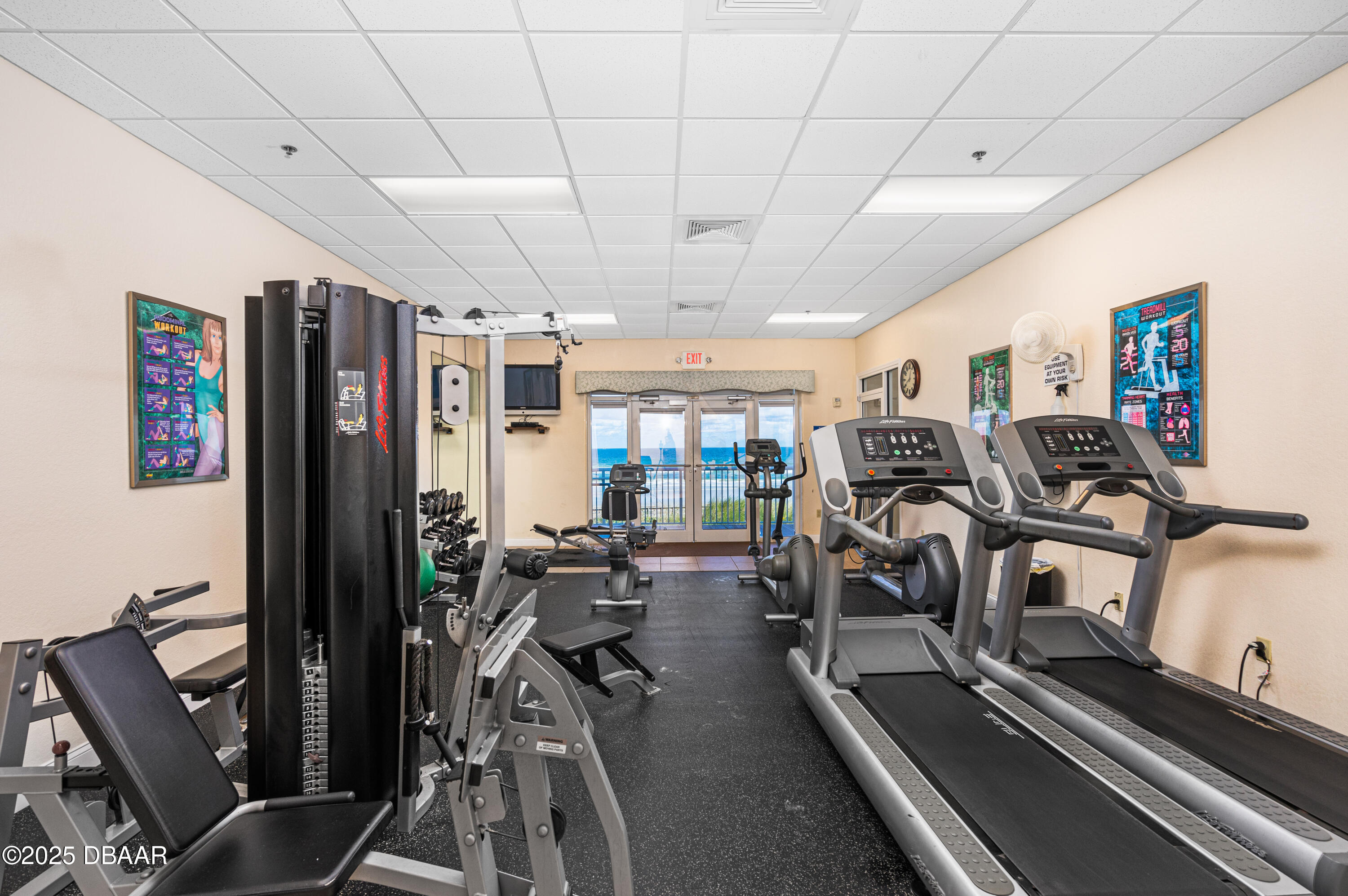 4650 Links Village Drive, Unit C303 Ponce Inlet, FL 32127 - Photo 59 of 67 a view of a room with gym equipment