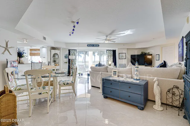a living room with lots of furniture and a rug
