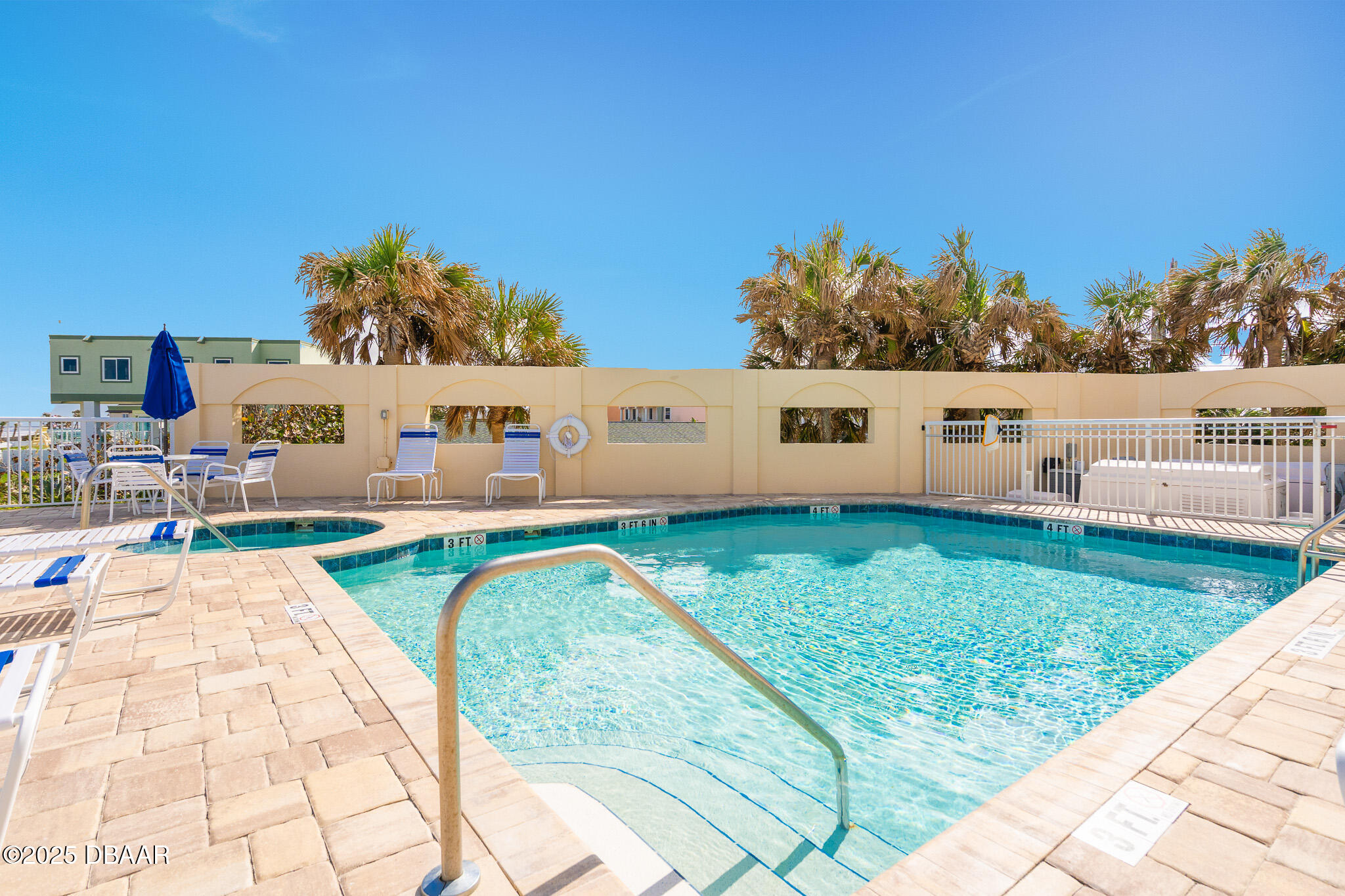 4650 Links Village Drive, Unit C303 Ponce Inlet, FL 32127 - Photo 62 of 67 a view of a swimming pool with a patio