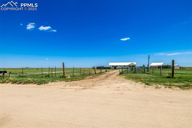 6065 Mulberry Road Calhan, CO 80808 - Photo 29 of 45 View of yard featuring a view of rural / pastoral area
