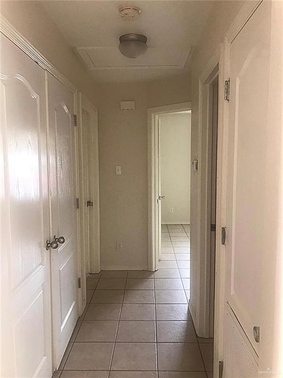 1105 South Palm Drive, Unit 1 Pharr, TX 78577 - Photo 4 of 11 a bathroom with a glass door shower