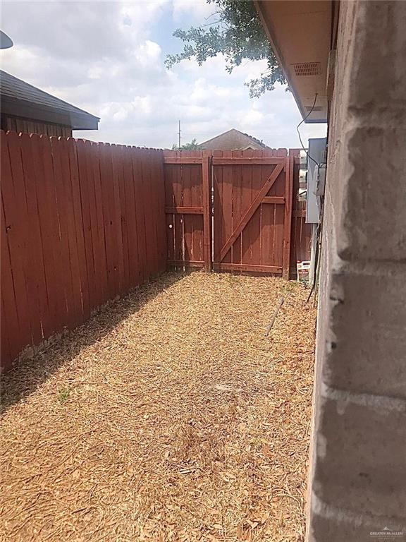 1105 South Palm Drive, Unit 1 Pharr, TX 78577 - Photo 6 of 11 a view of wooden fence