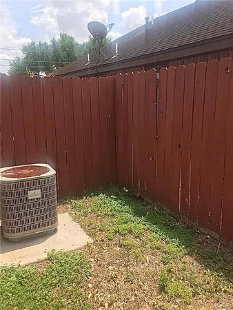 a view of outdoor space and wooden fence