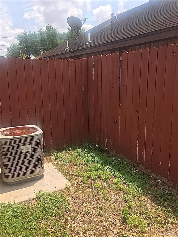 1105 South Palm Drive, Unit 1 Pharr, TX 78577 - Photo 7 of 11 a view of outdoor space and wooden fence