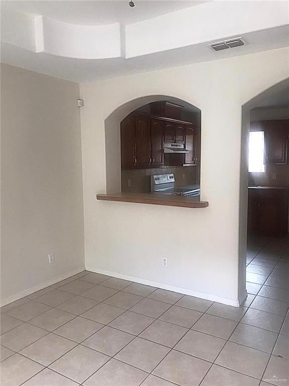 1105 South Palm Drive, Unit 1 Pharr, TX 78577 - Photo 8 of 11 a living room with a fireplace