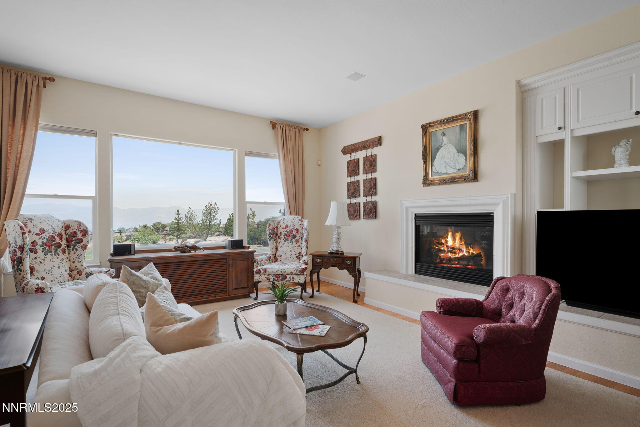 3206 Old Coach Court Reno, NV 89511 - Photo 11 of 40 a living room with furniture fireplace and a large window