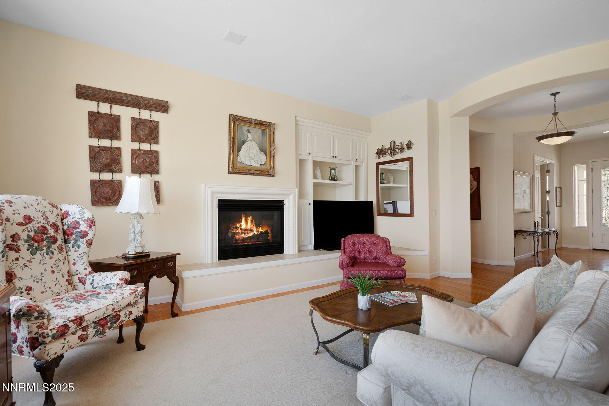 3206 Old Coach Court Reno, NV 89511 - Photo 14 of 40 a living room with furniture potted plant and a fireplace