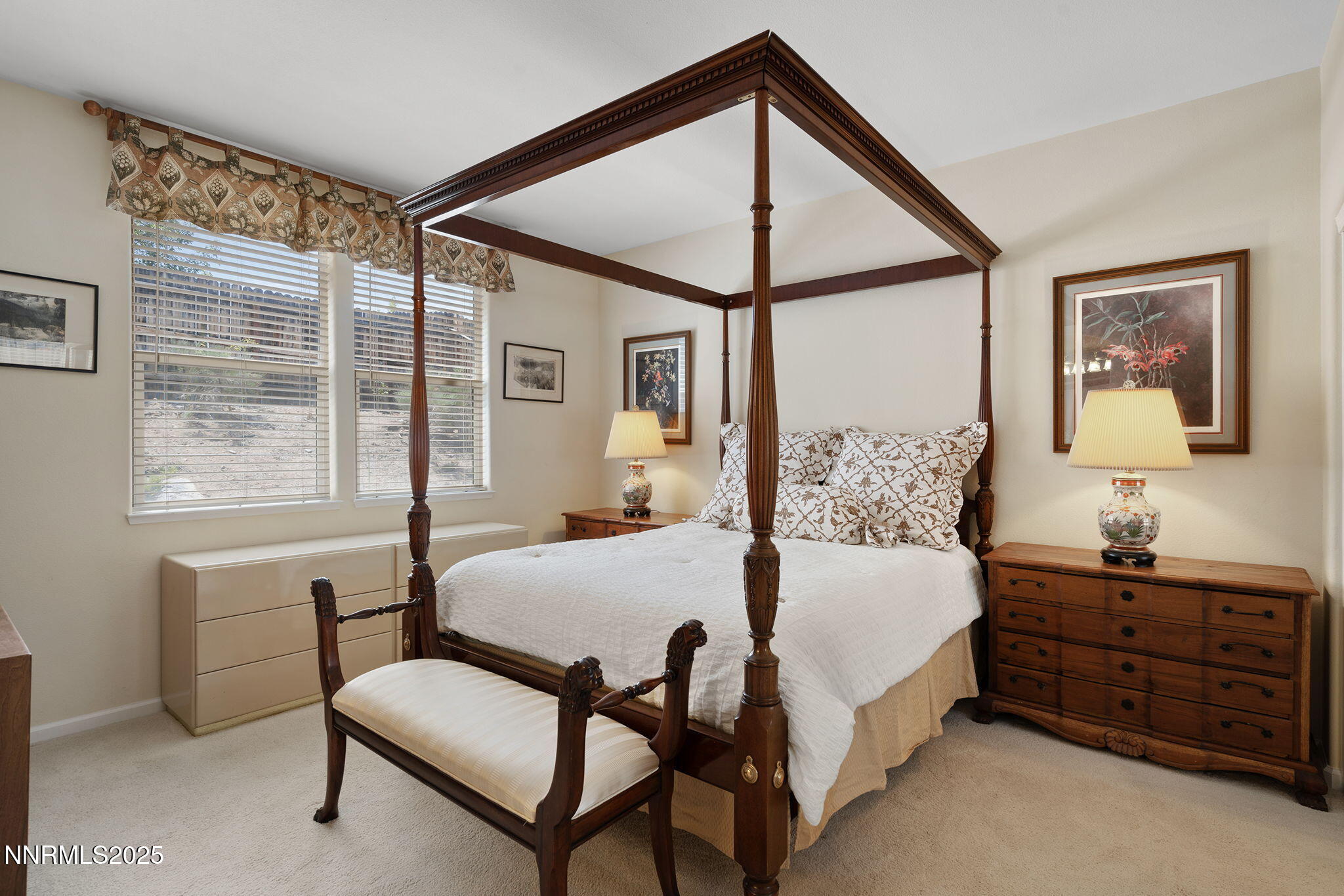 3206 Old Coach Court Reno, NV 89511 - Photo 28 of 40 a bedroom with a bed large window with table and chair