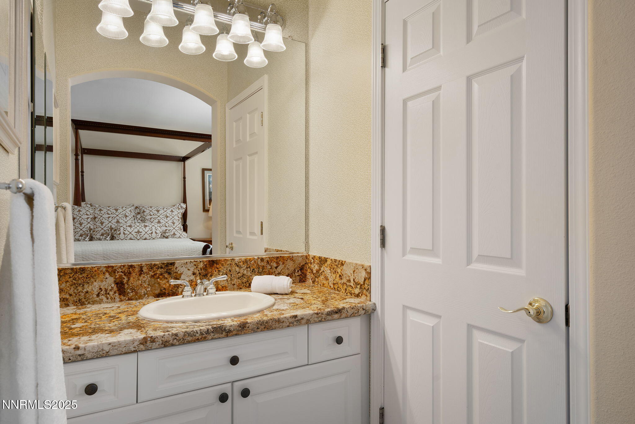 3206 Old Coach Court Reno, NV 89511 - Photo 29 of 40 a bathroom with a granite countertop sink and a mirror
