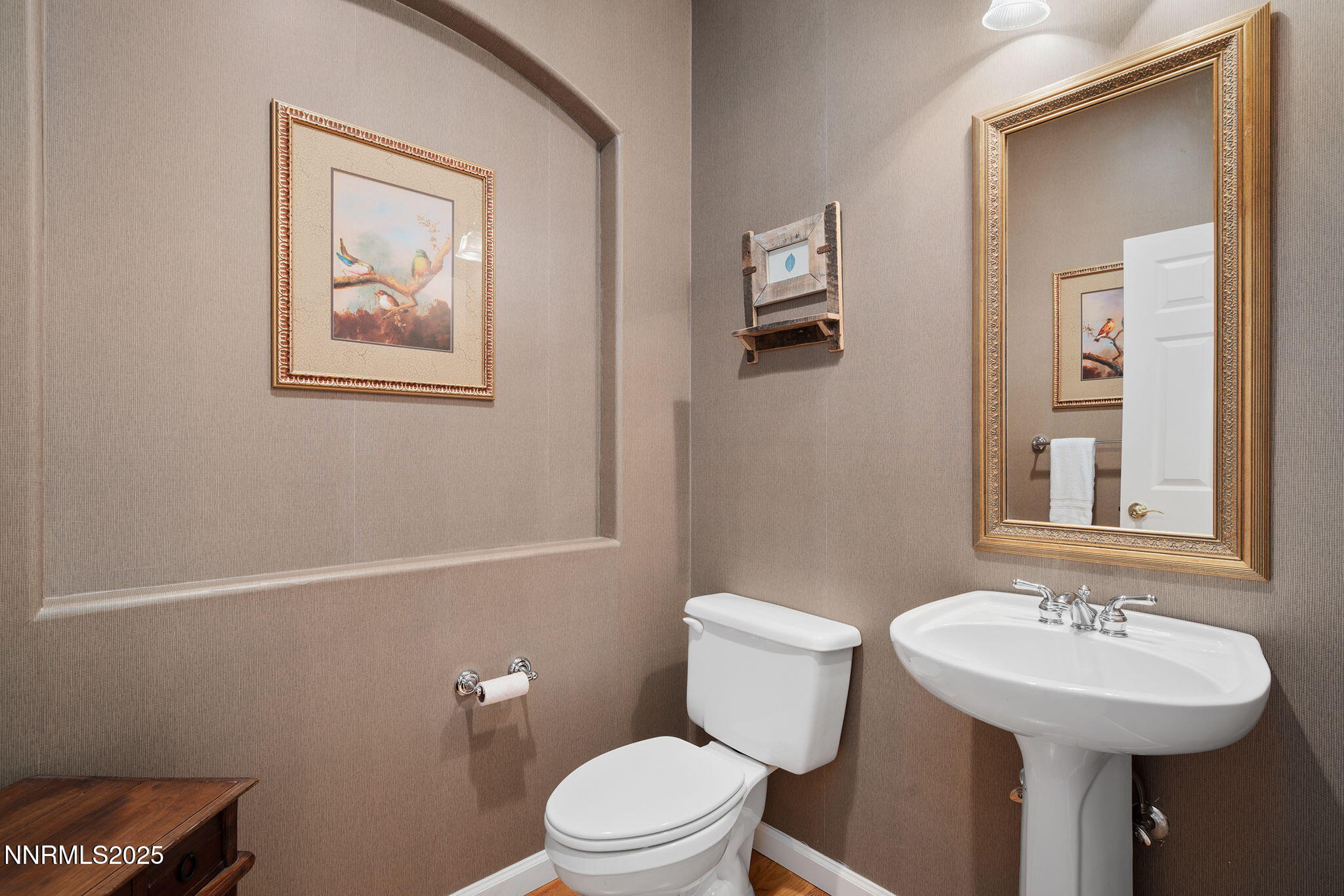 3206 Old Coach Court Reno, NV 89511 - Photo 32 of 40 a bathroom with a toilet a sink and mirror