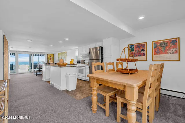 a living room with dining table and chairs