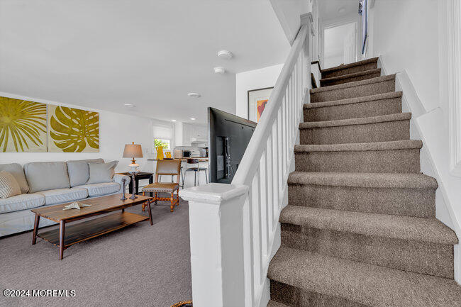 0 Beach Front Manasquan, NJ 08736 - Photo 27 of 47 a living room with furniture and a stair
