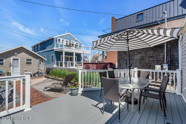 0 Beach Front Manasquan, NJ 08736 - Photo 8 of 47 a view of a house with a patio and a yard