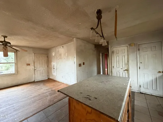 a view of a hallway with a kitchen
