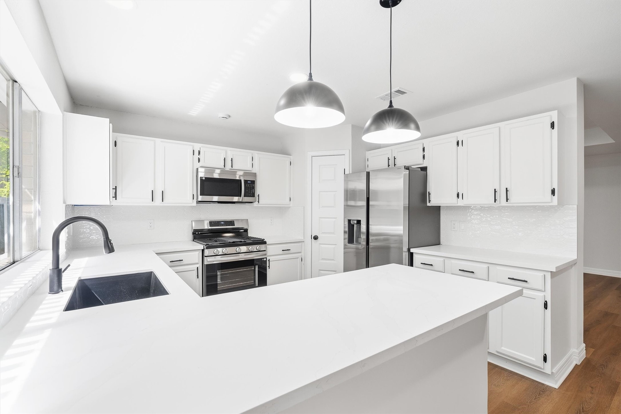 3 Still Corner Place Spring, TX 77381 - Photo 11 of 34 LIGHT & BRIGHT. A crisp subway tile backsplash sets off the stainless appliances, with a GAS RANGE ready for real cooking. Can you picture yourself cooking here?
