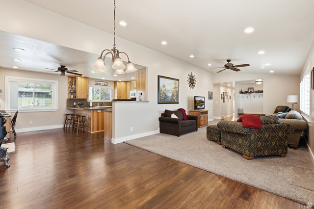 2420 West Old Hwy Road Morgan, UT 84050 - Photo 10 of 54 Living room featuring a ceiling fan, dark wood-style floors, and hanging lights
