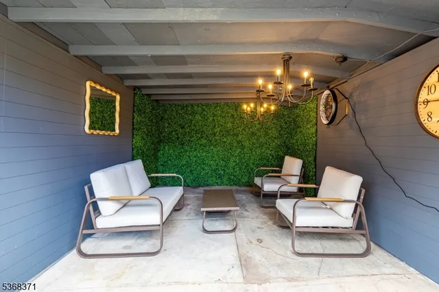 a view of two chairs in the patio