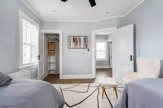 a bedroom with a bed and a couch