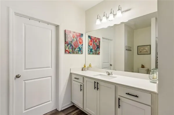a bathroom with a shower and a toilet