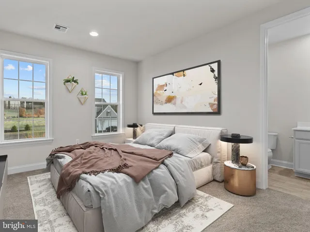 a bed room with a bed and a painting