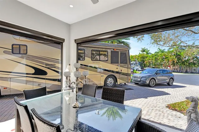 a living room with furniture fireplace and a large window