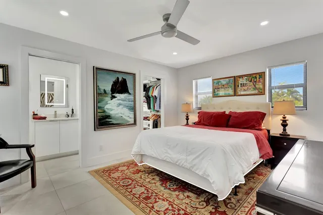 a bed room with a bed and a painting