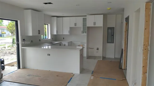 a view of kitchen with wooden floor
