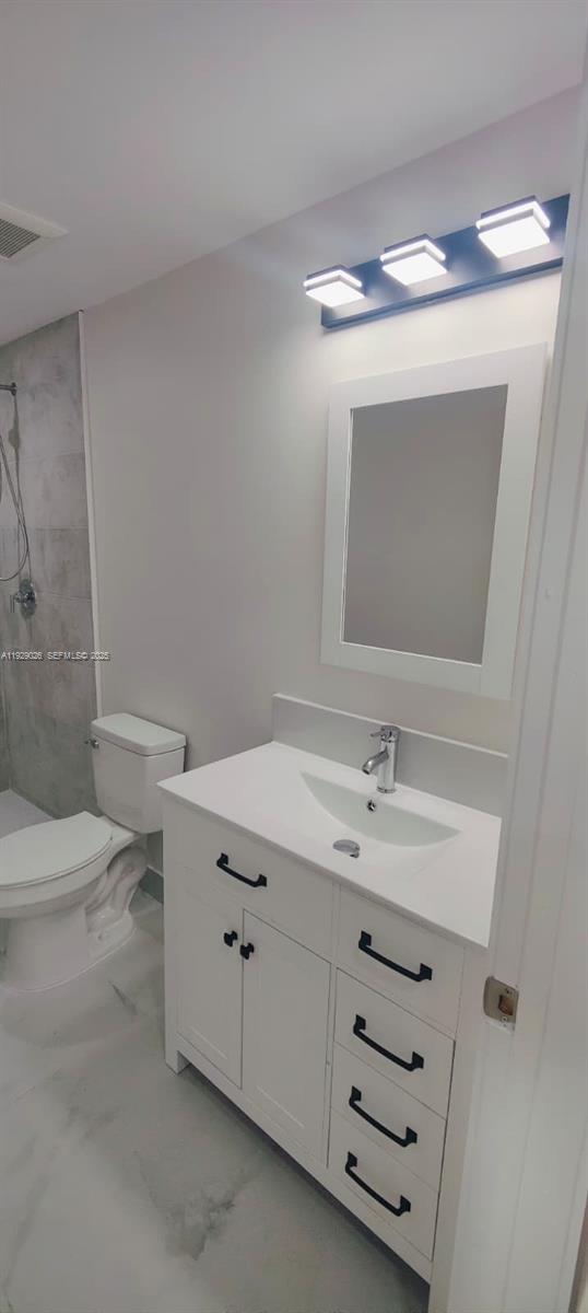 1901 Northwest 51st Terrace Miami, FL 33142 - Photo 6 of 13 a bathroom with a sink toilet and mirror