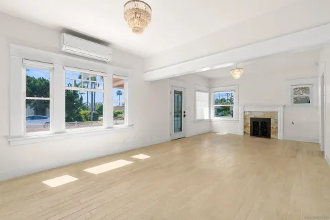 a view of a dining room with furniture and window