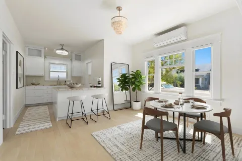 a view of a kitchen with microwave and windows