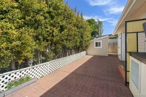 a view of a two chairs in a patio