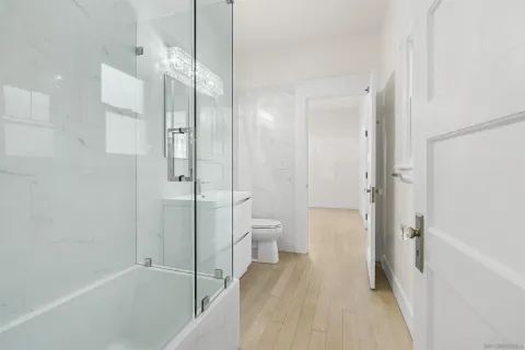 a bedroom with a bed and a lamp