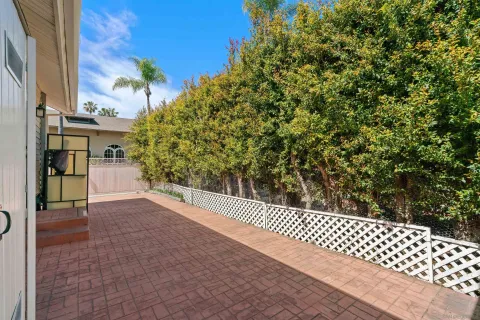 a view of a backyard of the house