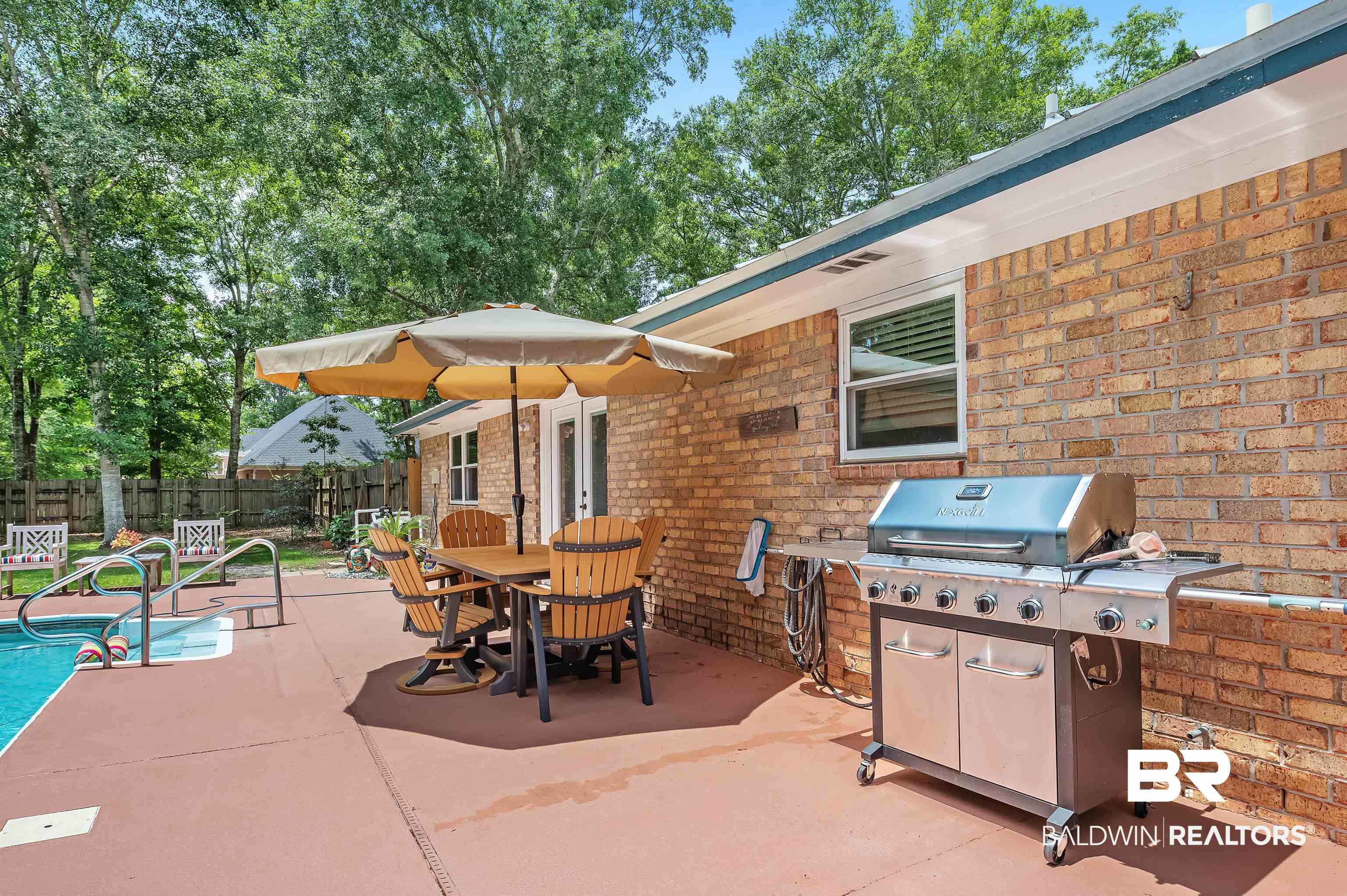 24551 Wolf Bay Drive Foley, AL 36535 - Photo 17 of 59 View of patio with a grill and outdoor dining area