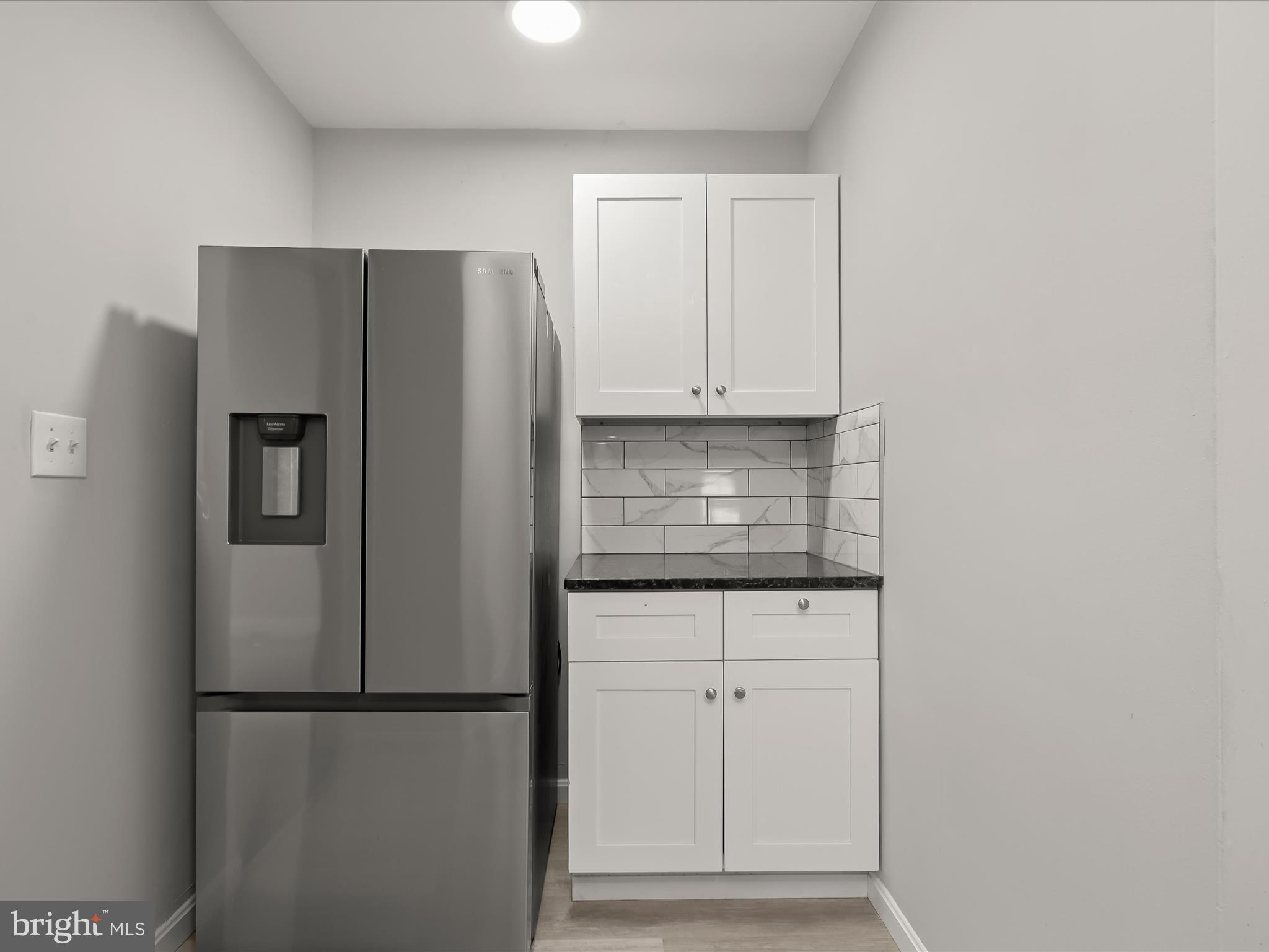 714 Stamford Road Baltimore, MD 21229 - Photo 13 of 31 a kitchen with cabinets and stainless steel appliances