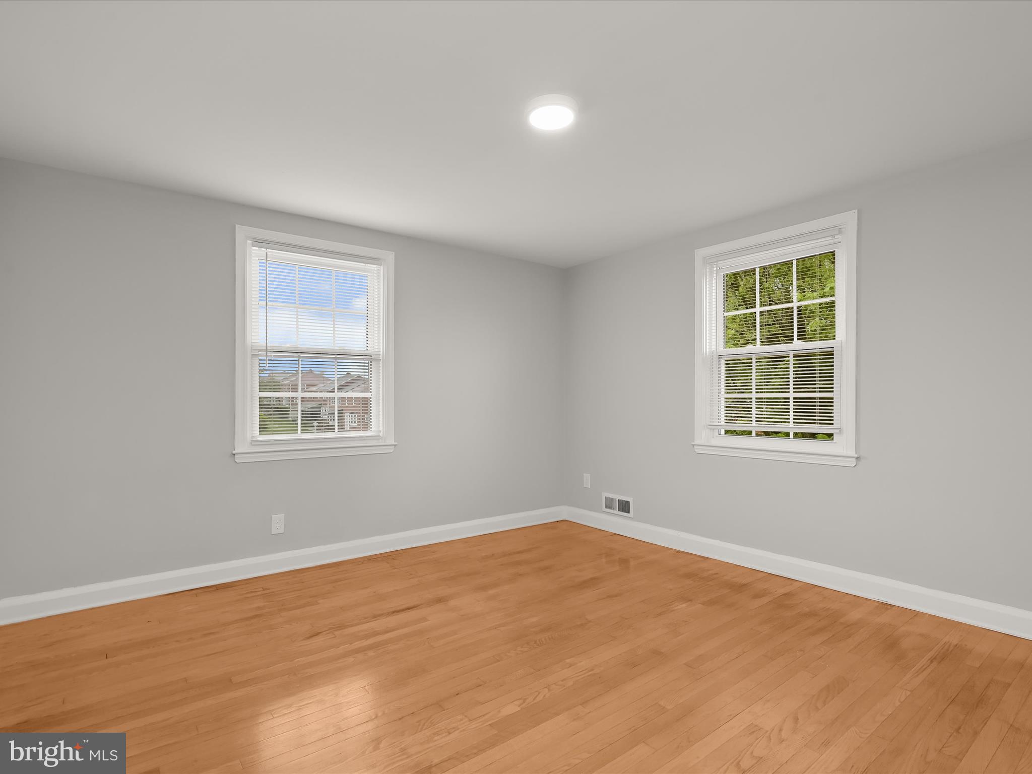 714 Stamford Road Baltimore, MD 21229 - Photo 15 of 31 a view of a room with wooden floor and windows