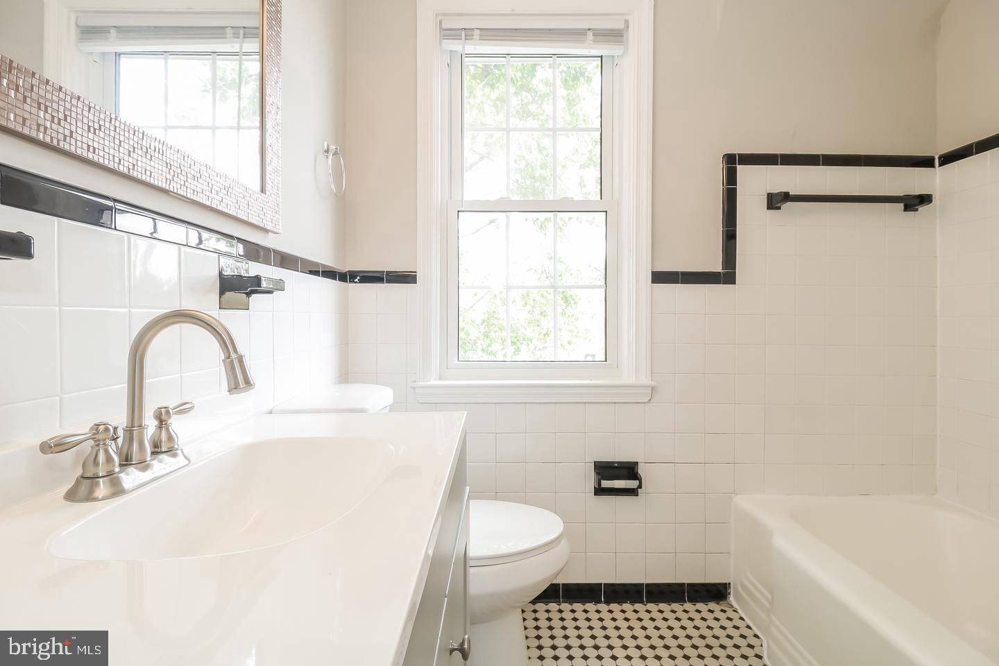 714 Stamford Road Baltimore, MD 21229 - Photo 20 of 31 a bathroom with a sink a toilet and a bathtub