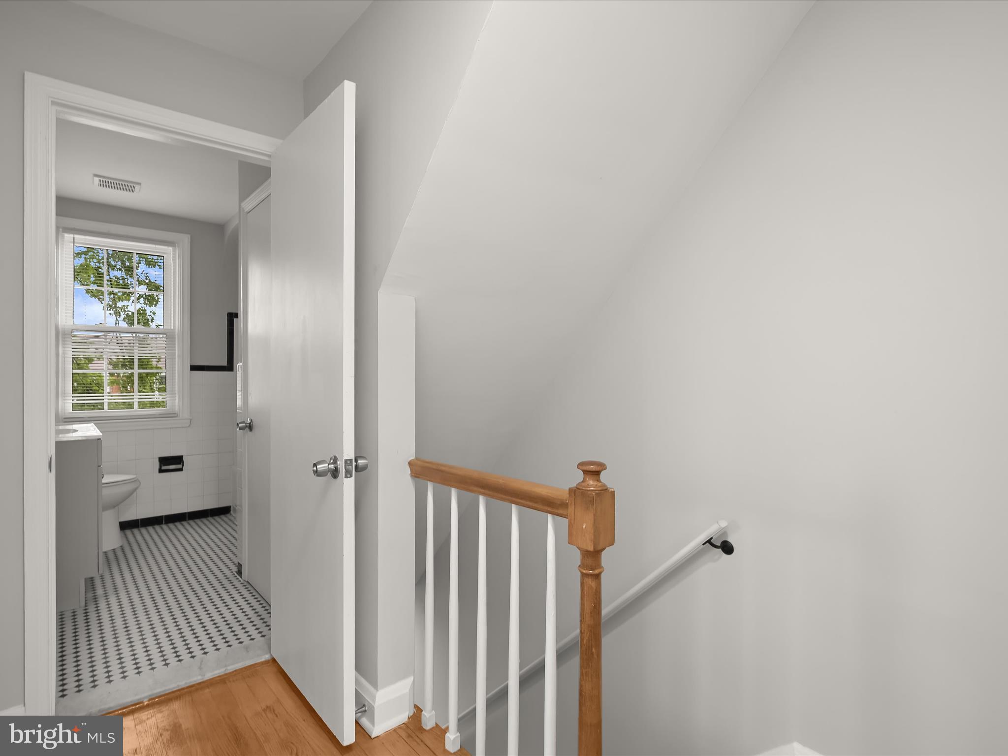 714 Stamford Road Baltimore, MD 21229 - Photo 26 of 31 a view of a hallway with a livingroom and a window