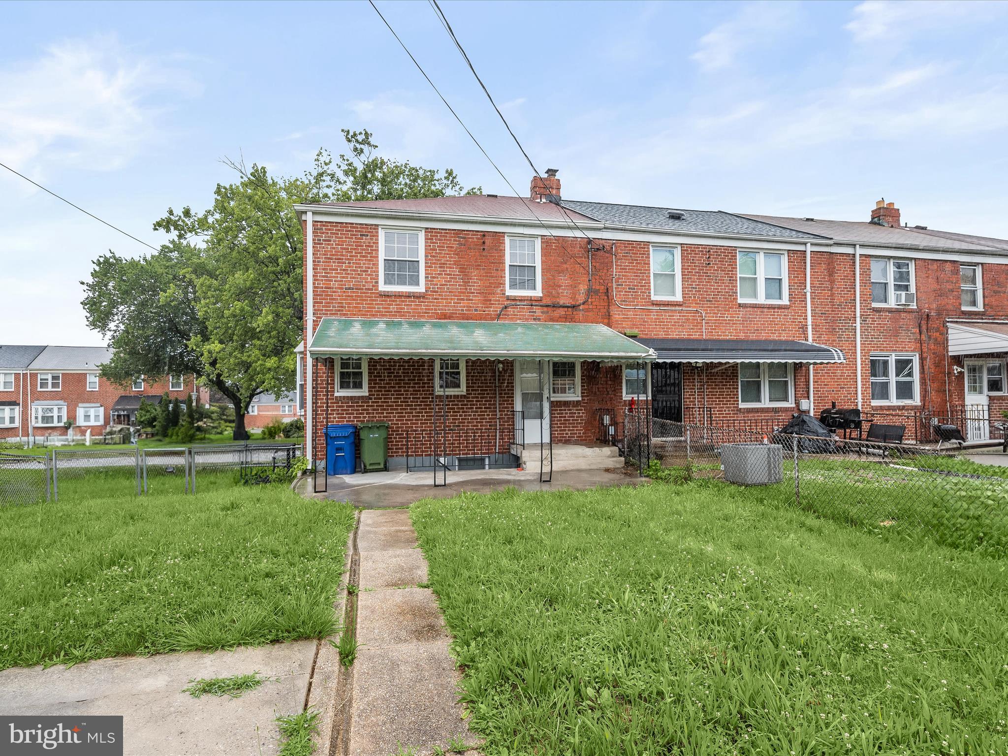 714 Stamford Road Baltimore, MD 21229 - Photo 28 of 31 a front view of a house with a yard table and chairs