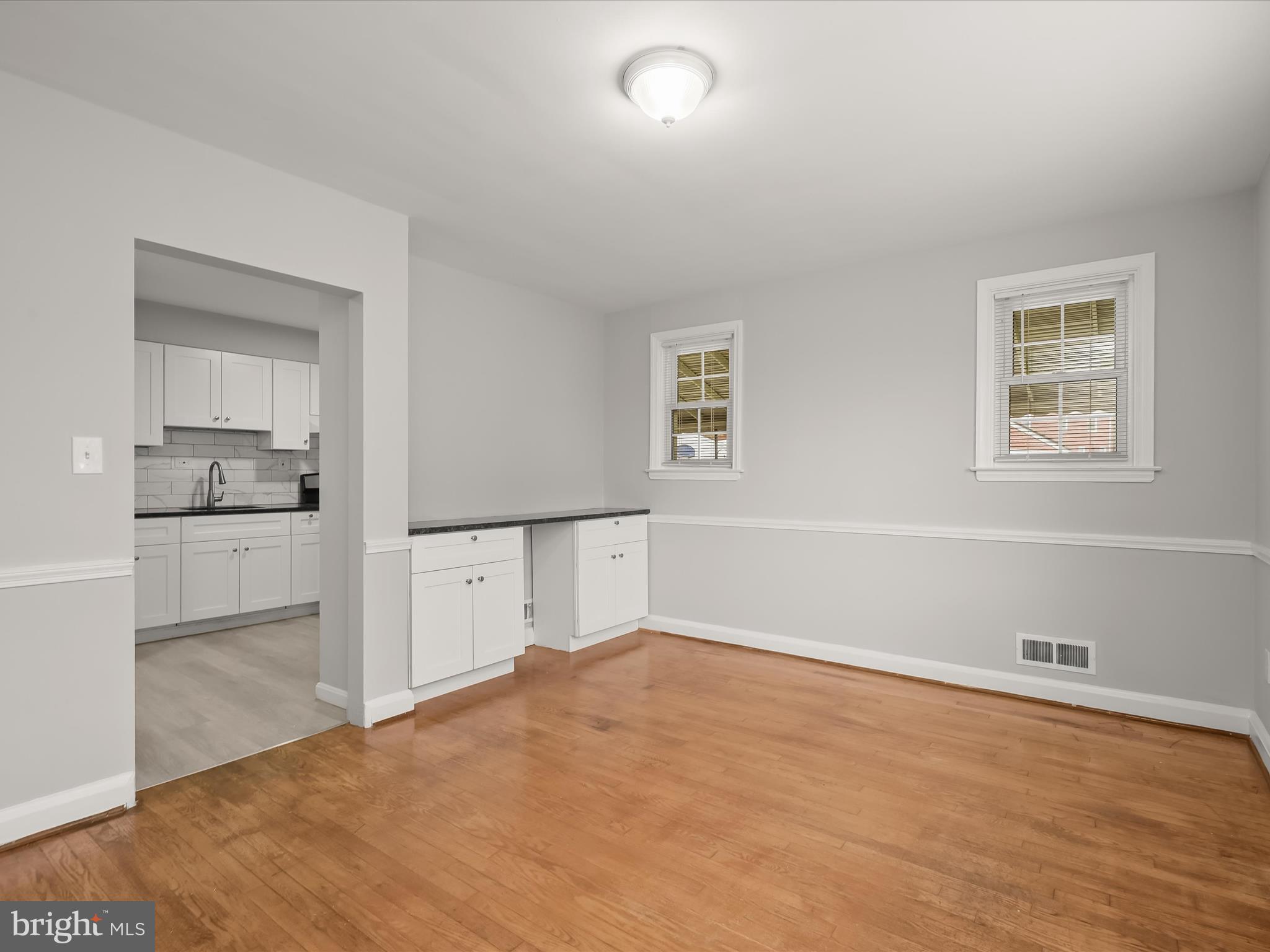 714 Stamford Road Baltimore, MD 21229 - Photo 8 of 31 a view of a kitchen with wooden floor and a window