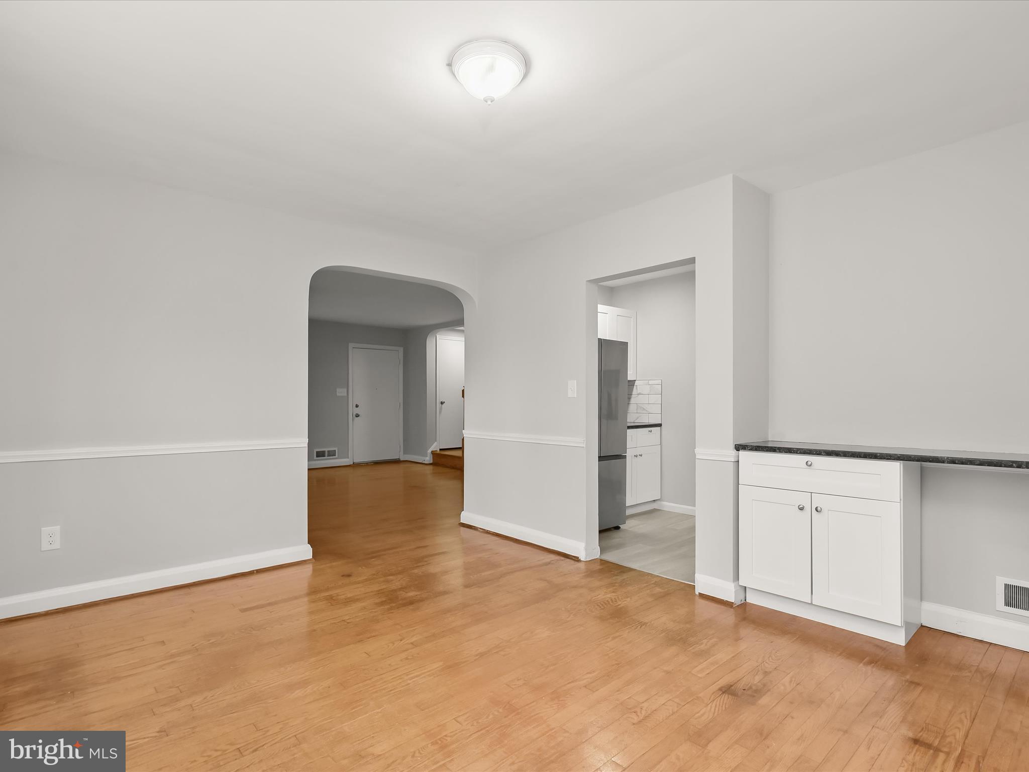 714 Stamford Road Baltimore, MD 21229 - Photo 9 of 31 wooden floor in an empty room