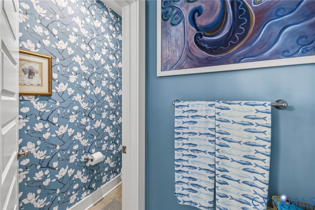 585 Hazel Place, Unit A Henrico, VA 23233 - Photo 19 of 26 a bathroom with a shower curtain