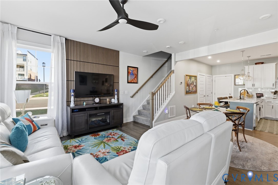 585 Hazel Place, Unit A Henrico, VA 23233 - Photo 5 of 26 a living room with furniture and a flat screen tv