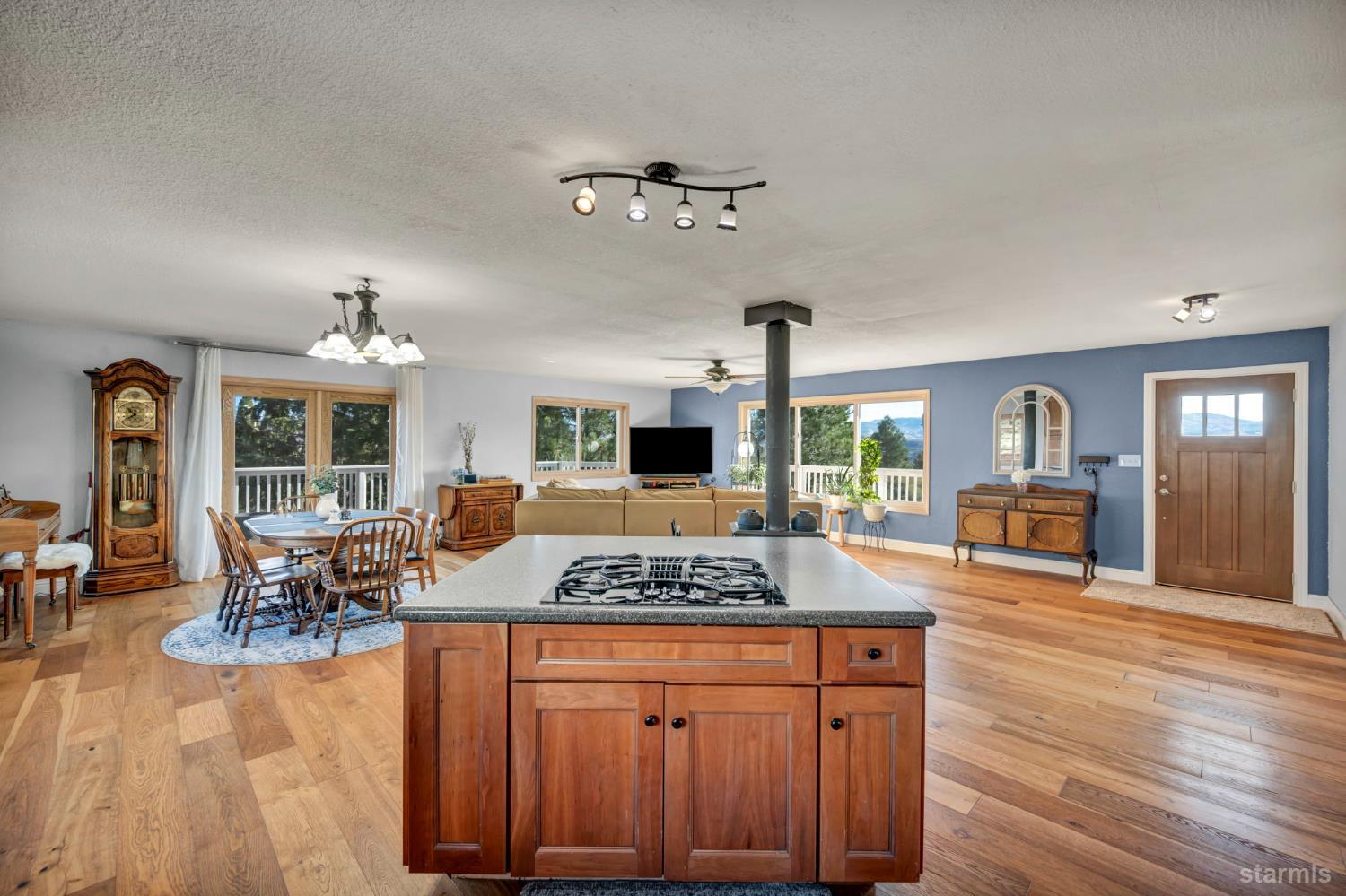 110 Carson View Markleeville, CA 96120 - Photo 13 of 39 a open kitchen with granite countertop a stove and a wooden floors