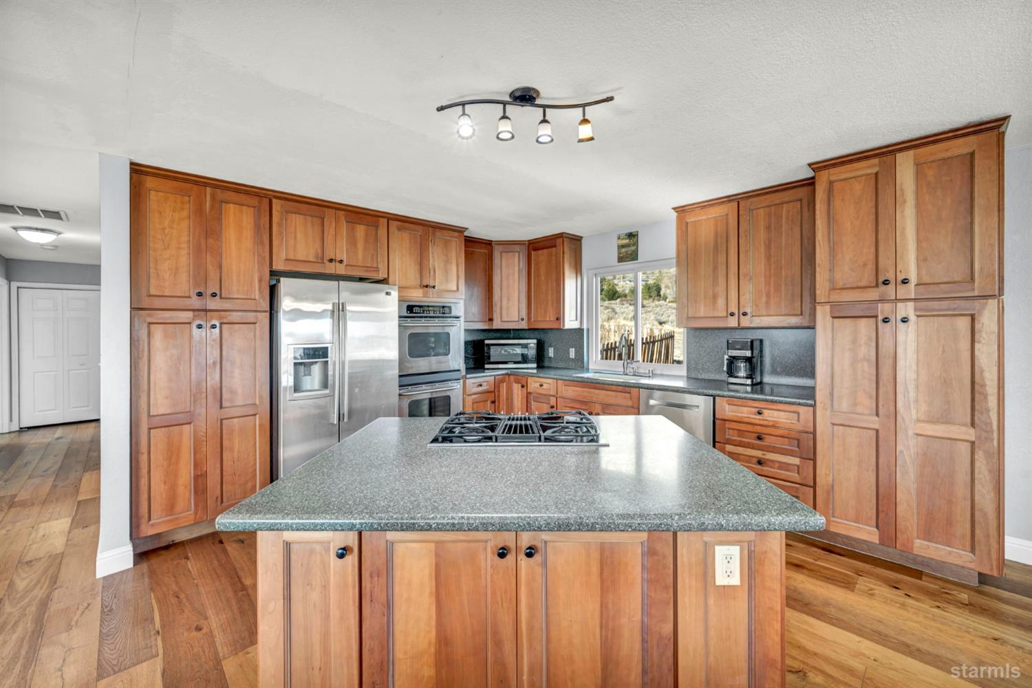 110 Carson View Markleeville, CA 96120 - Photo 15 of 39 a kitchen with granite countertop a refrigerator a stove a sink and dishwasher