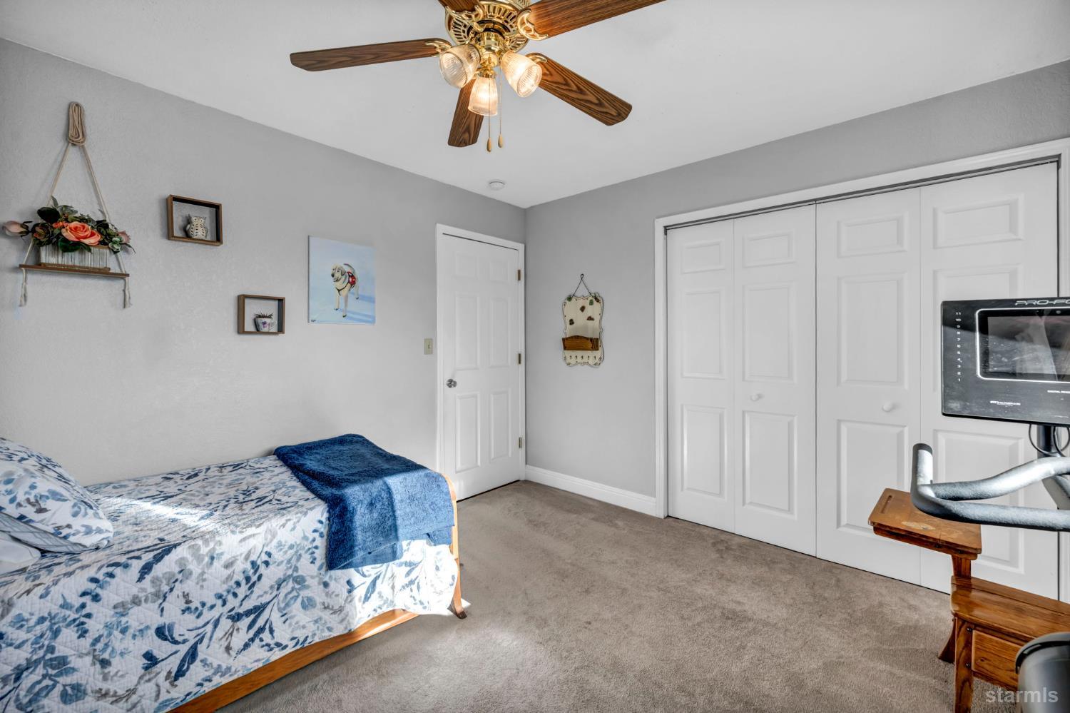 110 Carson View Markleeville, CA 96120 - Photo 22 of 39 a bedroom with a bed and a chandelier