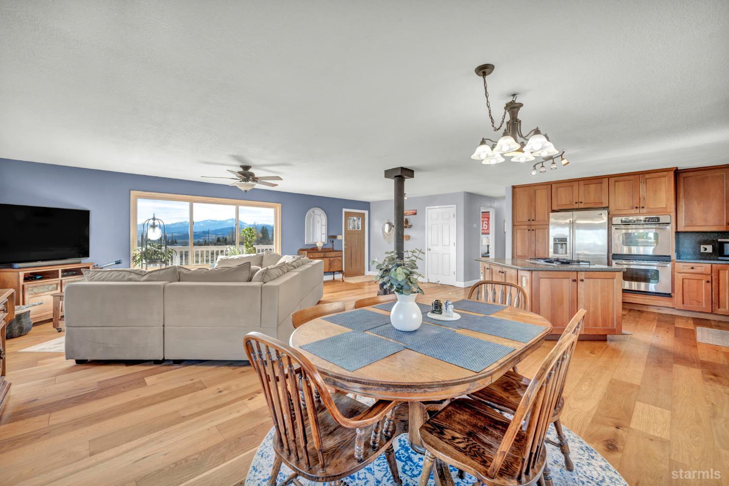 110 Carson View Markleeville, CA 96120 - Photo 7 of 39 a view of a dining room with furniture wooden floor and chandelier
