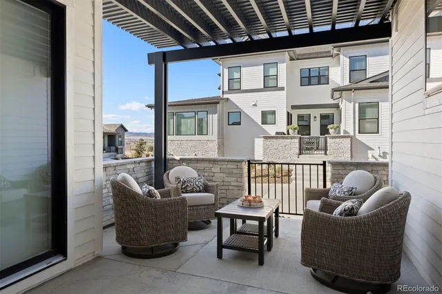 a balcony with furniture and water view