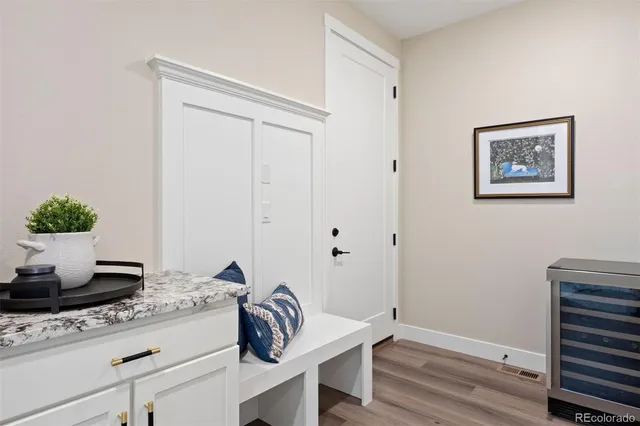 a view of a livingroom with furniture and wooden floor