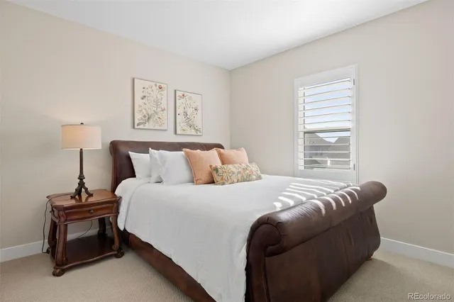 a bedroom with bed and a window